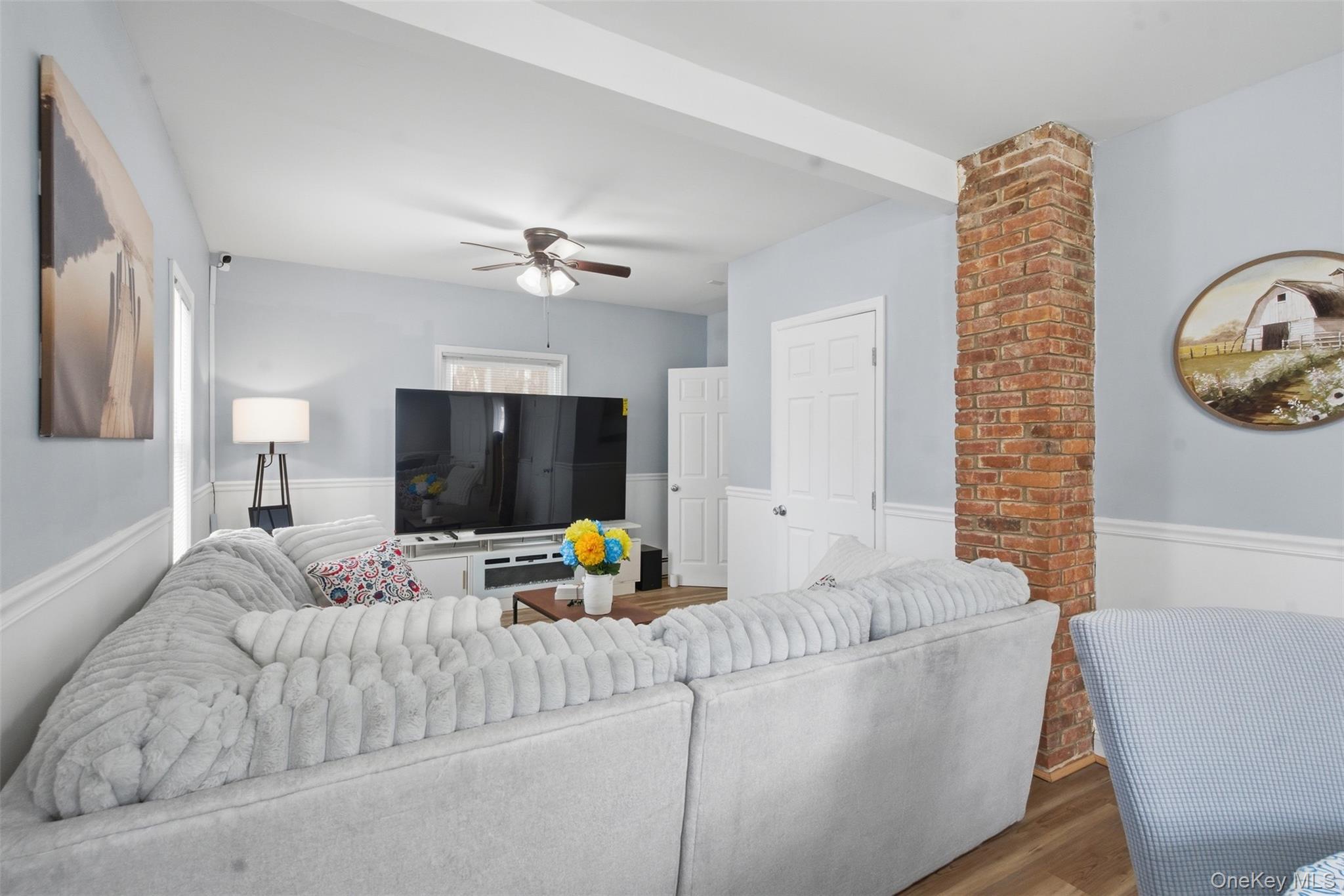 64 Wait Street Walden, NY 12586 - Photo 10 of 26 a living room with furniture and a flat screen tv