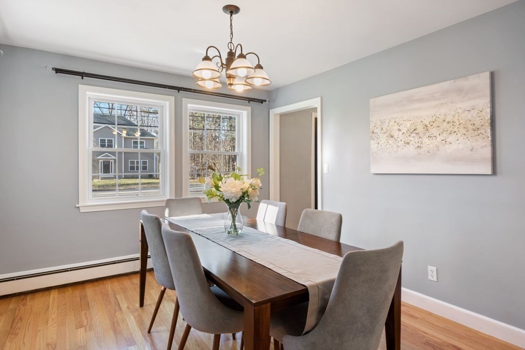 143 Grove Street Lexington, MA 02420 - Photo 11 of 34 a view of a dining room with furniture window and wooden floor