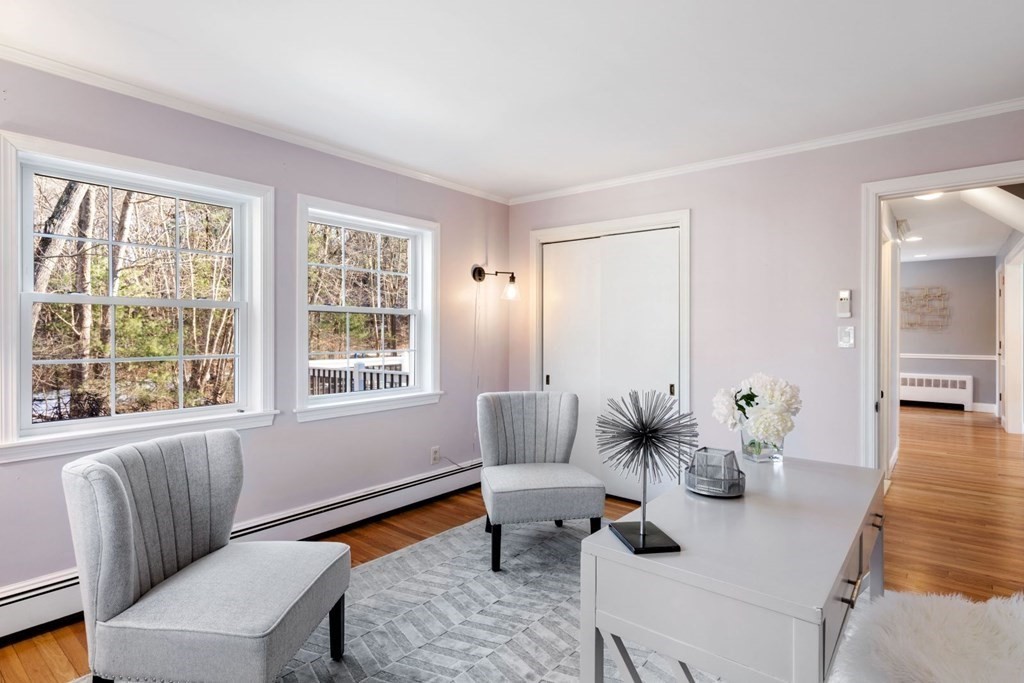 143 Grove Street Lexington, MA 02420 - Photo 15 of 34 a living room with furniture and floor to ceiling windows