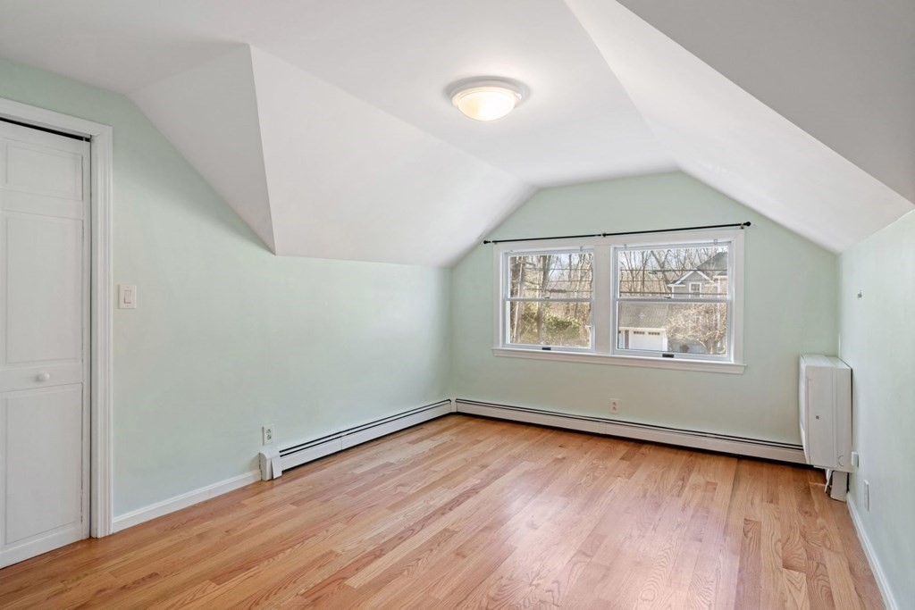 143 Grove Street Lexington, MA 02420 - Photo 24 of 34 an empty room with wooden floor and windows