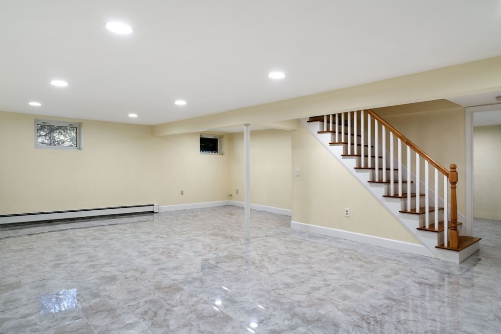 143 Grove Street Lexington, MA 02420 - Photo 26 of 34 a view of an empty room with stairs