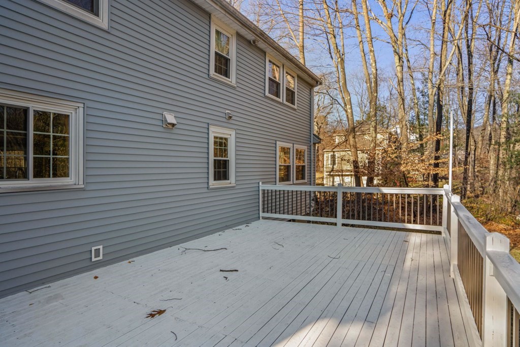 143 Grove Street Lexington, MA 02420 - Photo 29 of 34 a view of a house with a wooden fence
