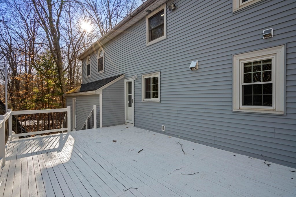 143 Grove Street Lexington, MA 02420 - Photo 30 of 34 a view of a house with a deck