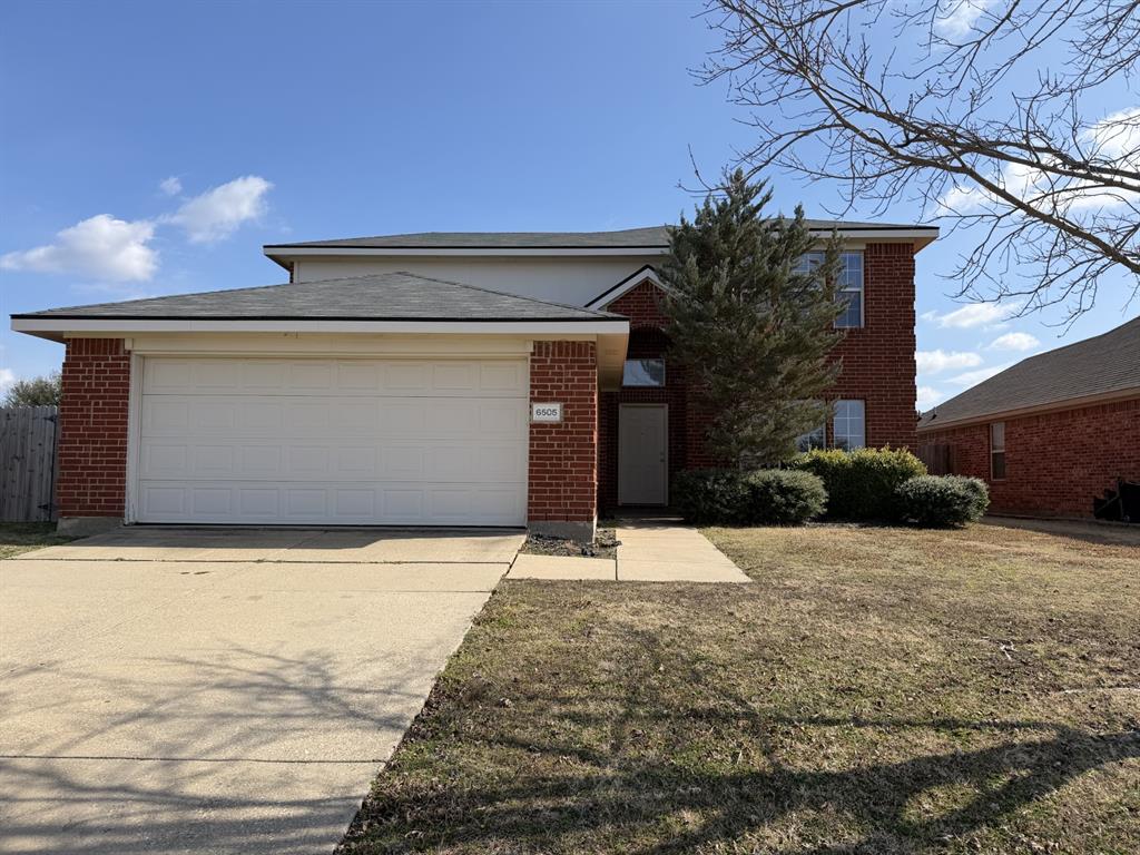 a front view of house with yard
