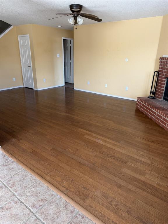 6505 Rienzi Drive Greenville, TX 75402 - Photo 12 of 40 wooden floor in an empty room with a window