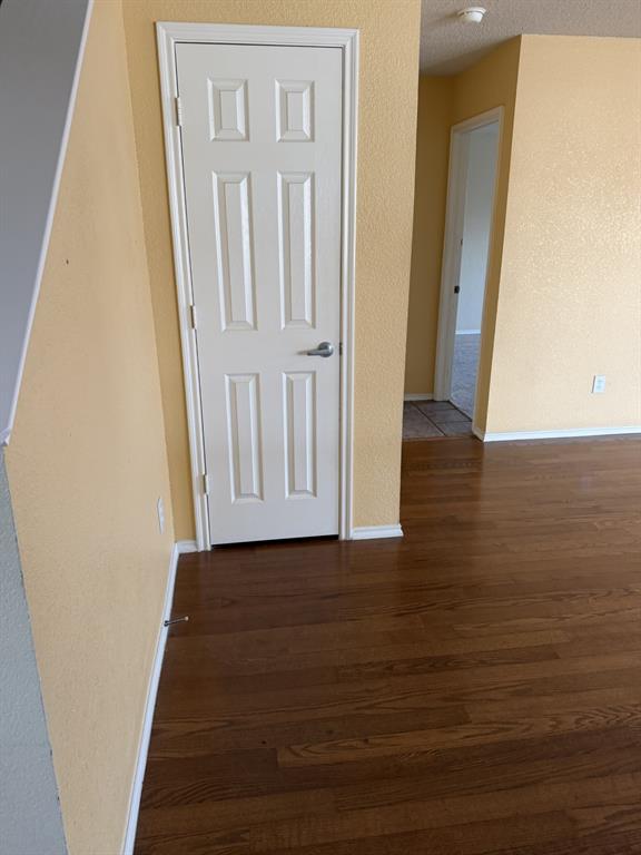 6505 Rienzi Drive Greenville, TX 75402 - Photo 13 of 40 a view of a hallway with wooden floor and staircase