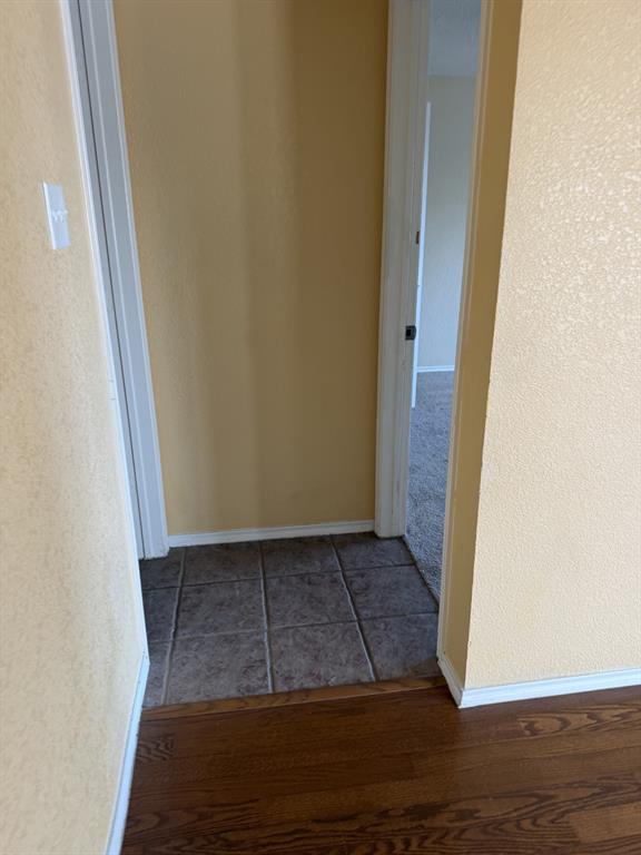 6505 Rienzi Drive Greenville, TX 75402 - Photo 14 of 40 a view of an empty room with wooden floor