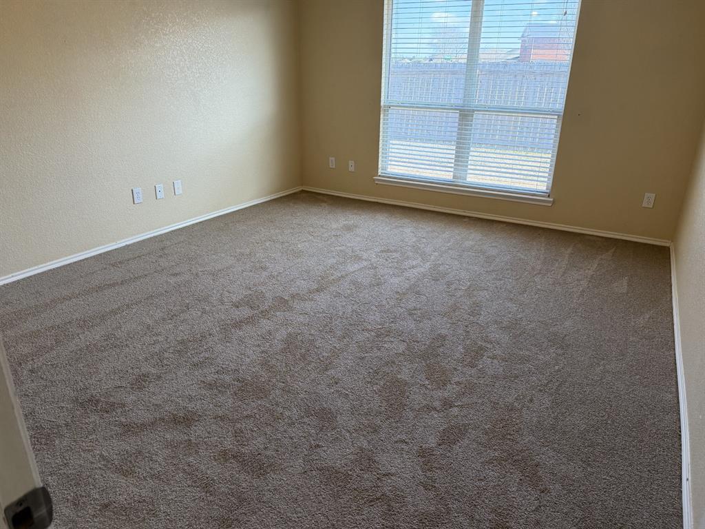 6505 Rienzi Drive Greenville, TX 75402 - Photo 17 of 40 an empty room with windows