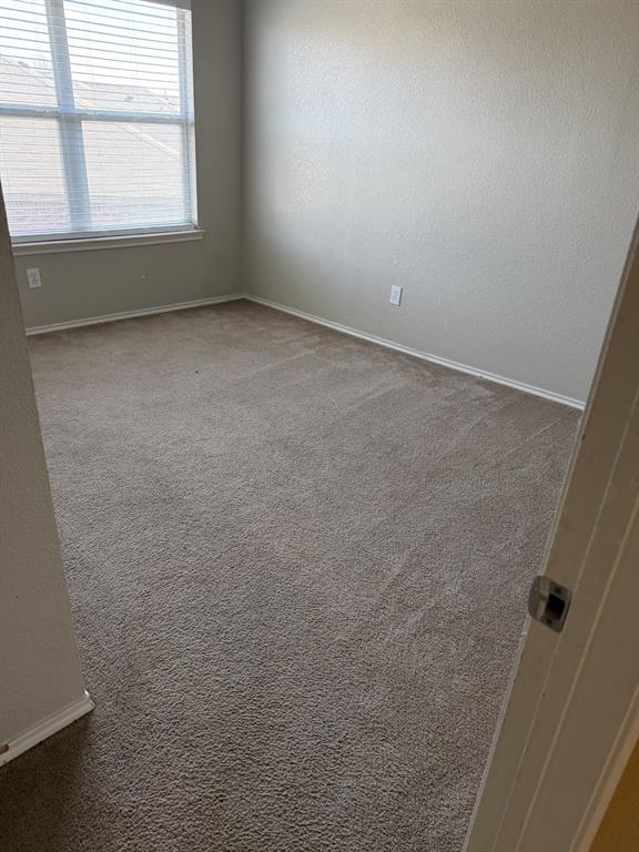 6505 Rienzi Drive Greenville, TX 75402 - Photo 30 of 40 an empty room with a window