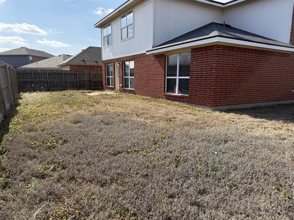 6505 Rienzi Drive Greenville, TX 75402 - Photo 36 of 40 a front view of a house with a yard