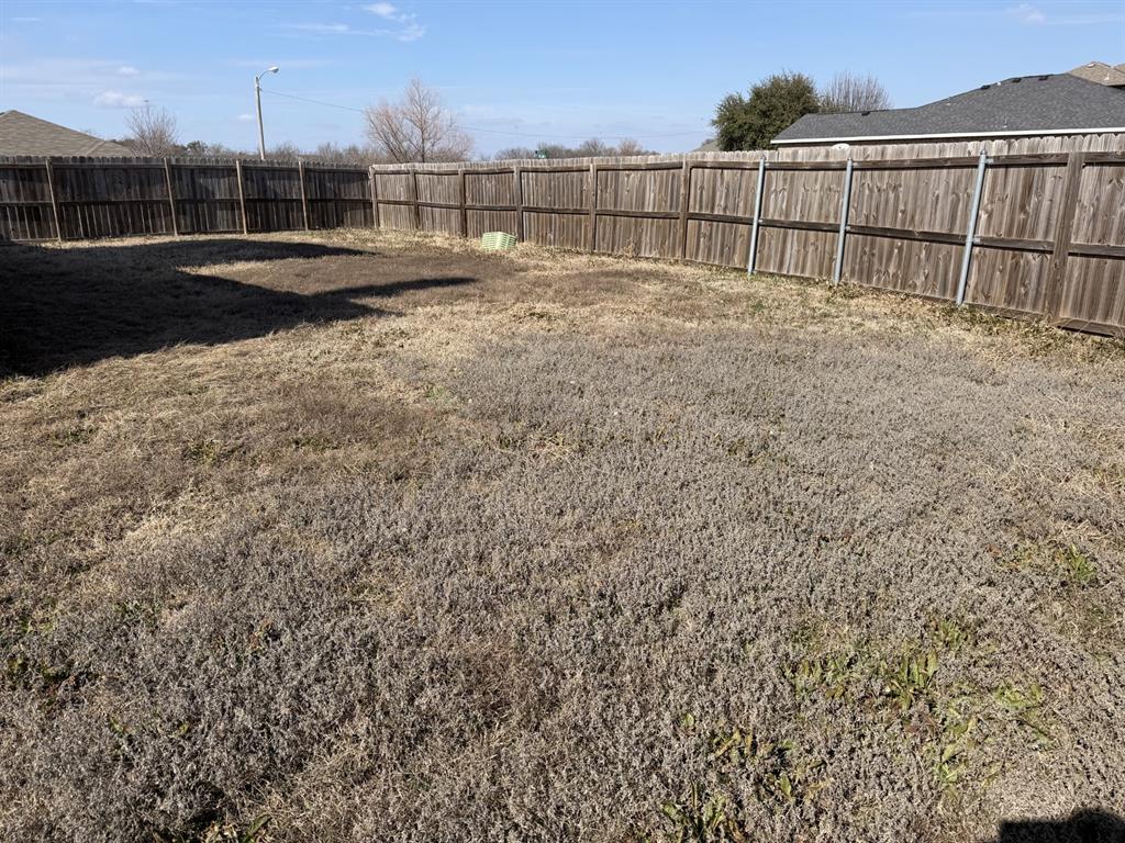 6505 Rienzi Drive Greenville, TX 75402 - Photo 37 of 40 a view of yard with wooden fence