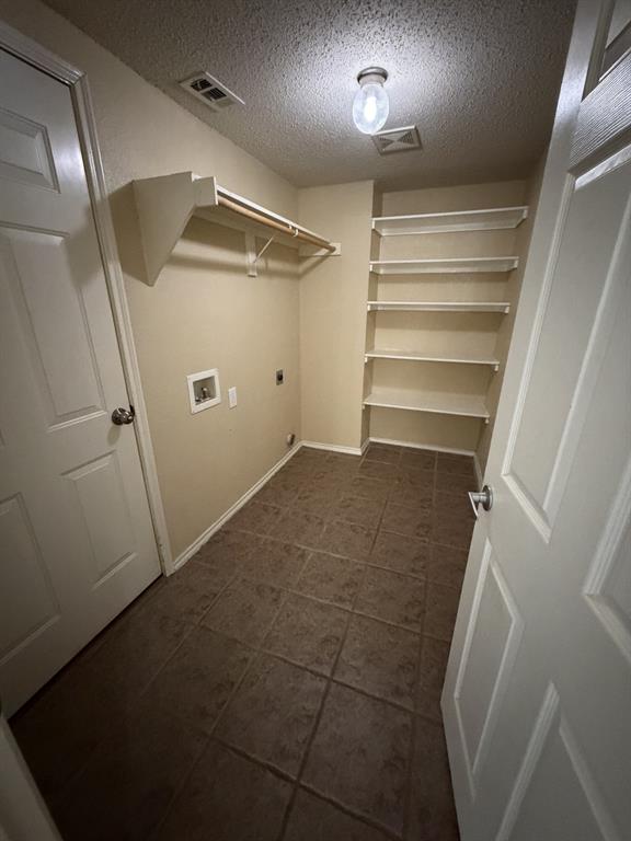 6505 Rienzi Drive Greenville, TX 75402 - Photo 4 of 40 a view of walk in closet with empty racks