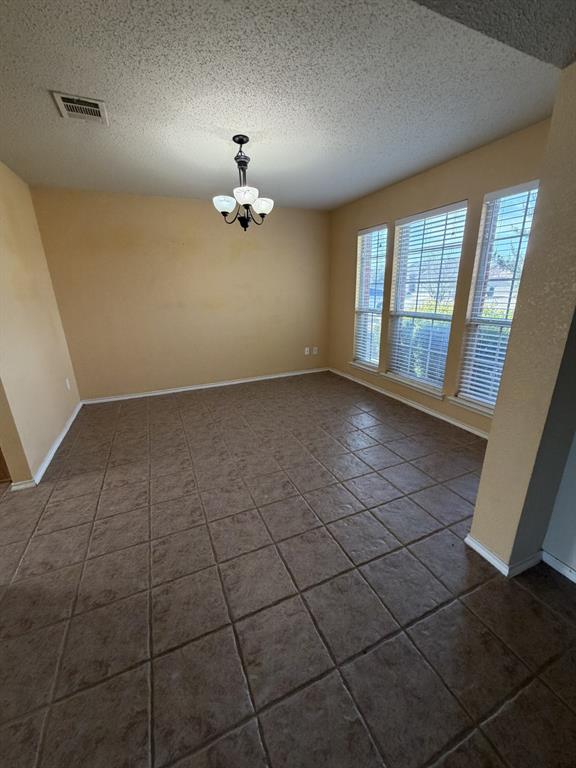 6505 Rienzi Drive Greenville, TX 75402 - Photo 5 of 40 a view of an empty room with a window