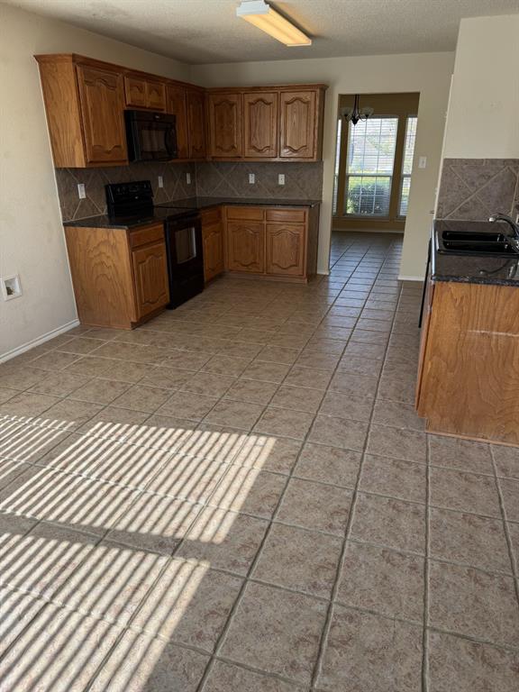 6505 Rienzi Drive Greenville, TX 75402 - Photo 9 of 40 a large kitchen with cabinets