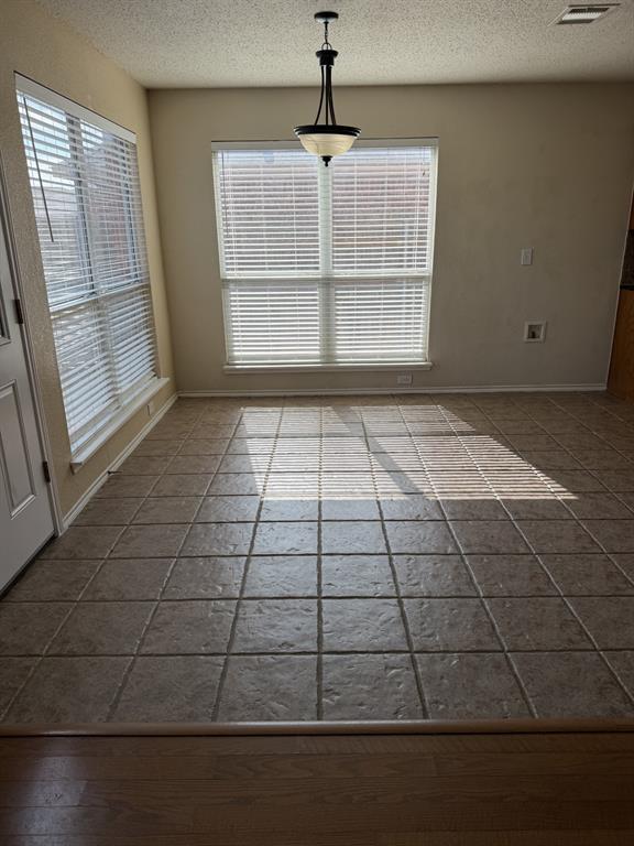 6505 Rienzi Drive Greenville, TX 75402 - Photo 10 of 40 a view of empty room with windows