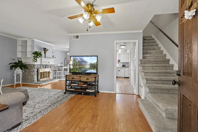 a view of a livingroom with furniture and a flat screen tv