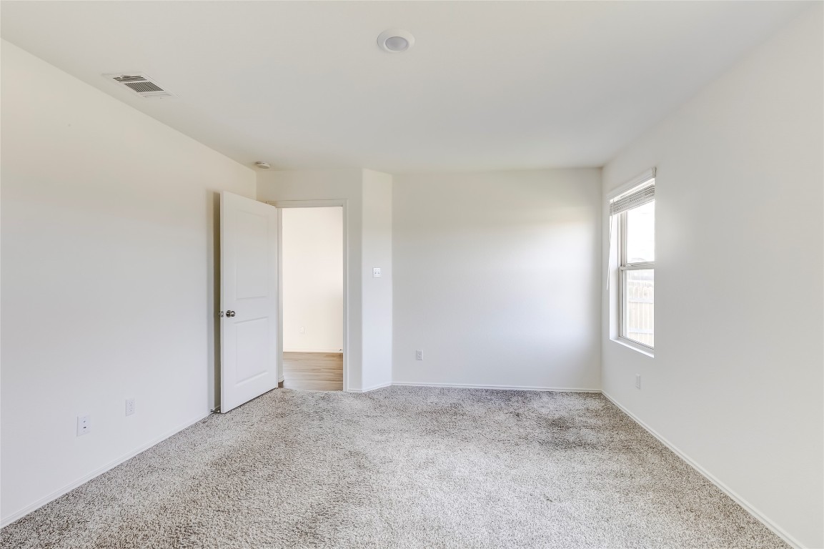 545 Greatest Gift Way Jarrell, TX 76537 - Photo 21 of 34 View of carpeted empty room