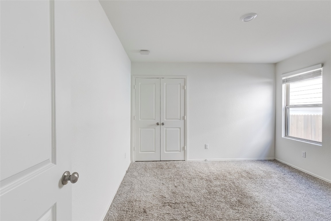 545 Greatest Gift Way Jarrell, TX 76537 - Photo 25 of 34 Spare room featuring carpet floors and baseboards