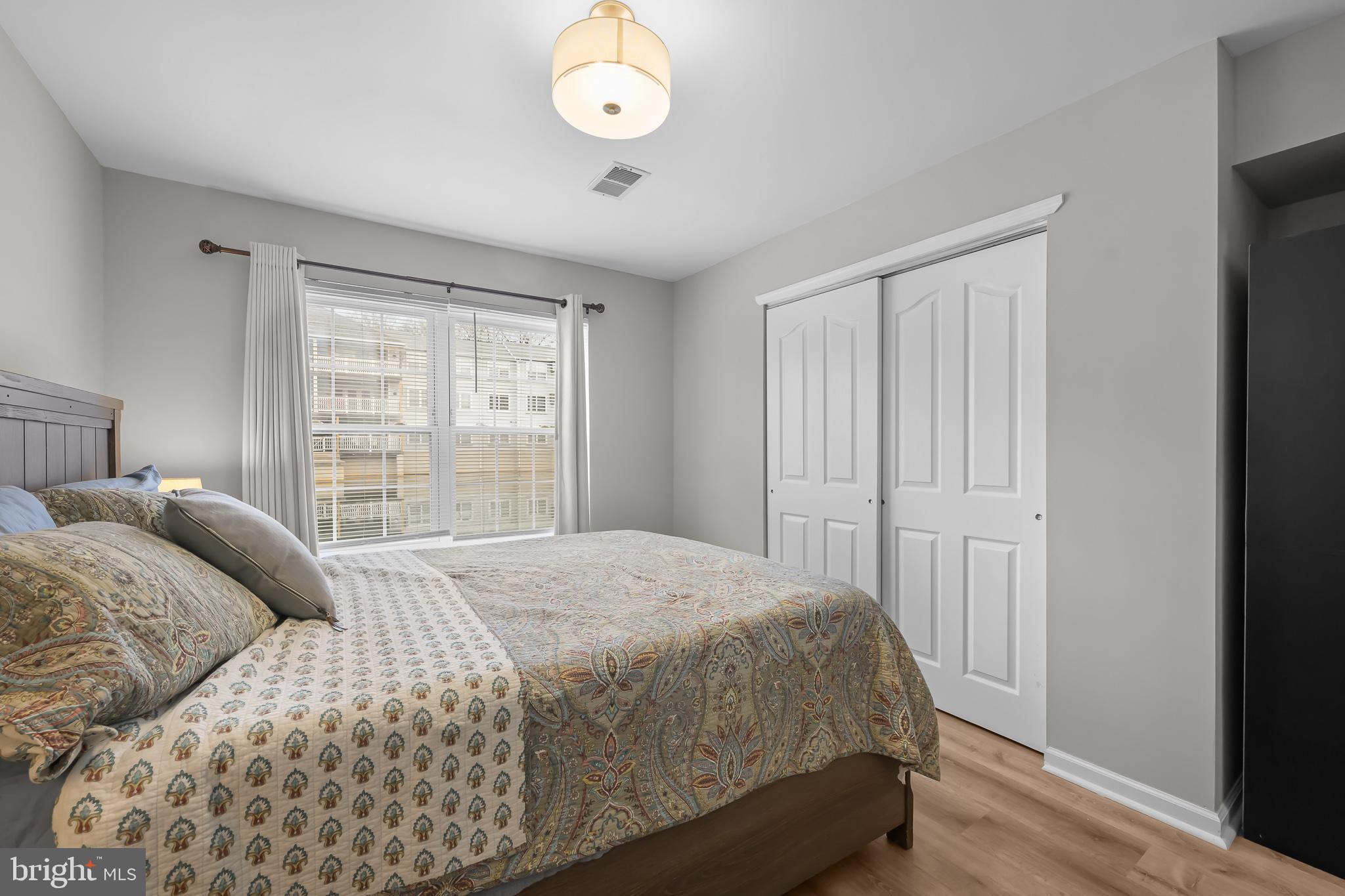 800 Waters Edge Drive Newark, DE 19702 - Photo 16 of 20 a bedroom with a bed and window