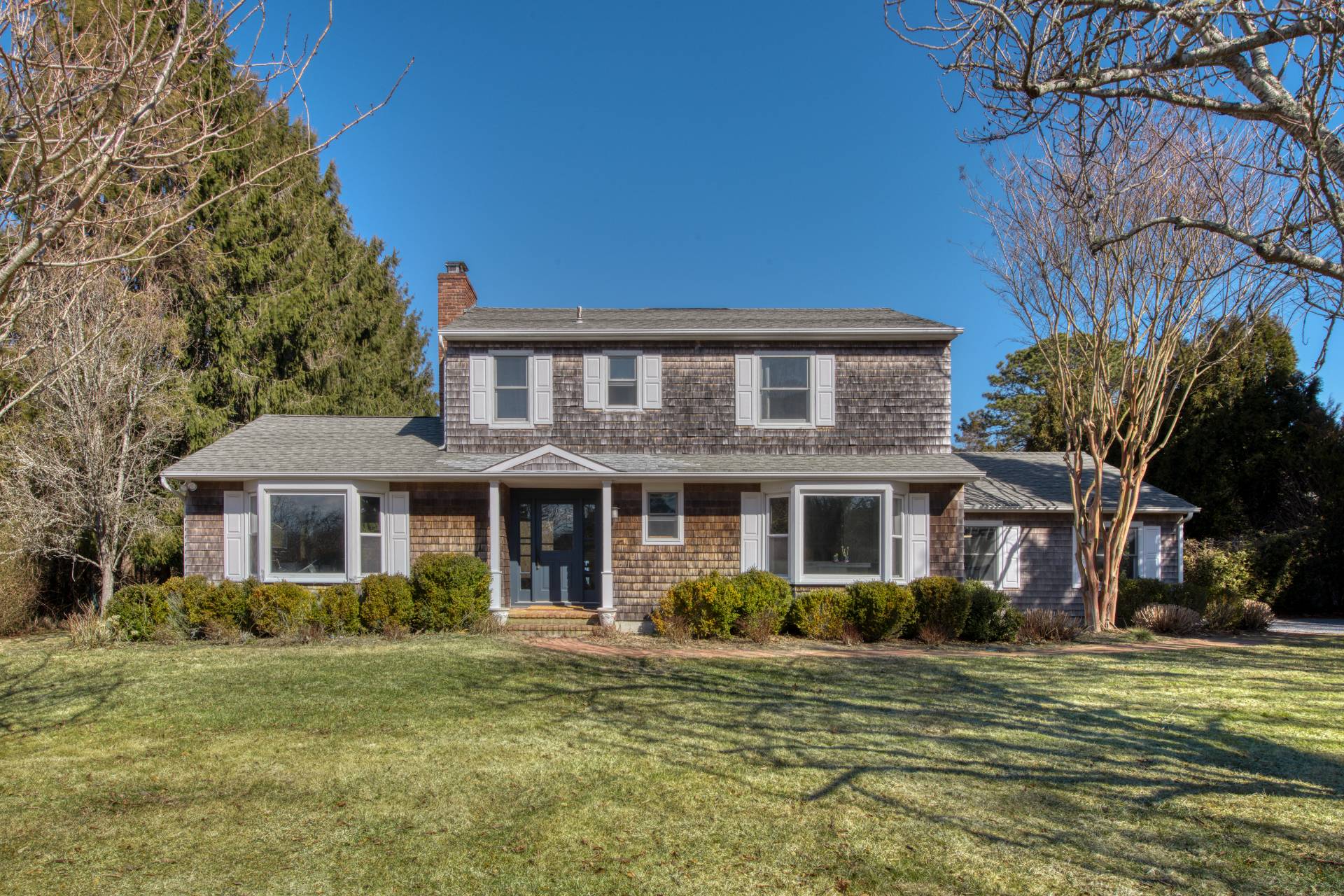 59 Dundee Lane Southampton, NY 11968 - Photo 1 of 10 a front view of a house with a garden