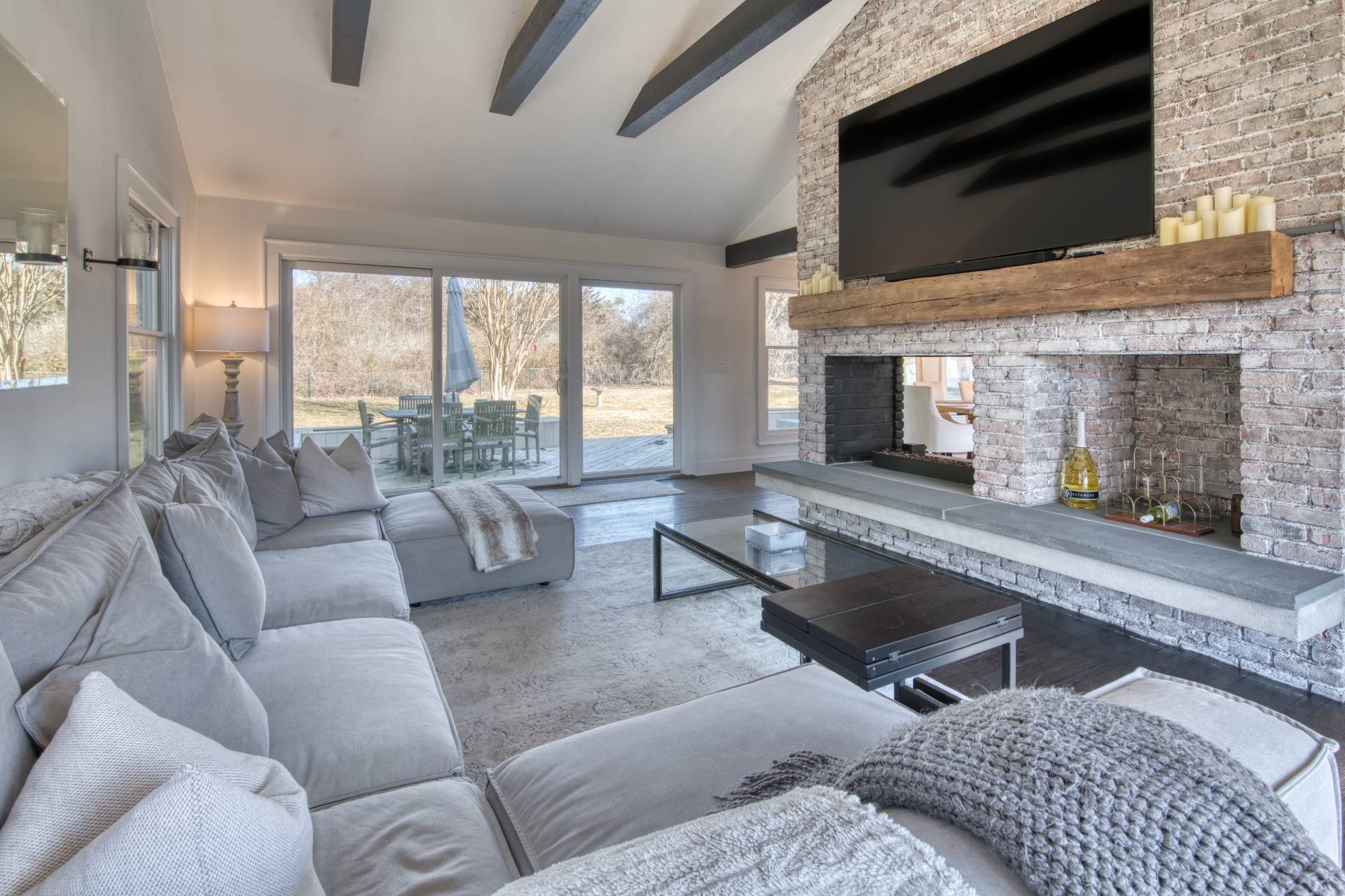 59 Dundee Lane Southampton, NY 11968 - Photo 3 of 10 a living room with furniture and a fireplace