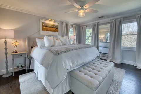 a bedroom with a large bed and a window