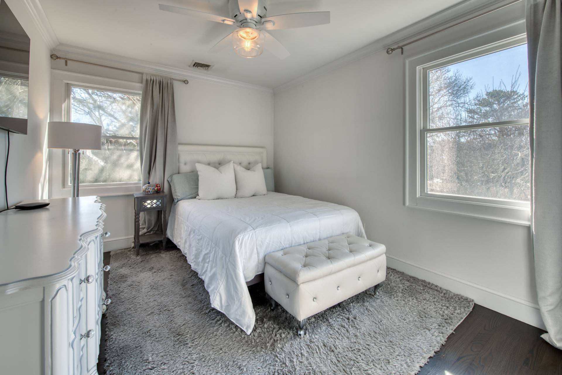 59 Dundee Lane Southampton, NY 11968 - Photo 8 of 10 a bedroom with a bed and a window