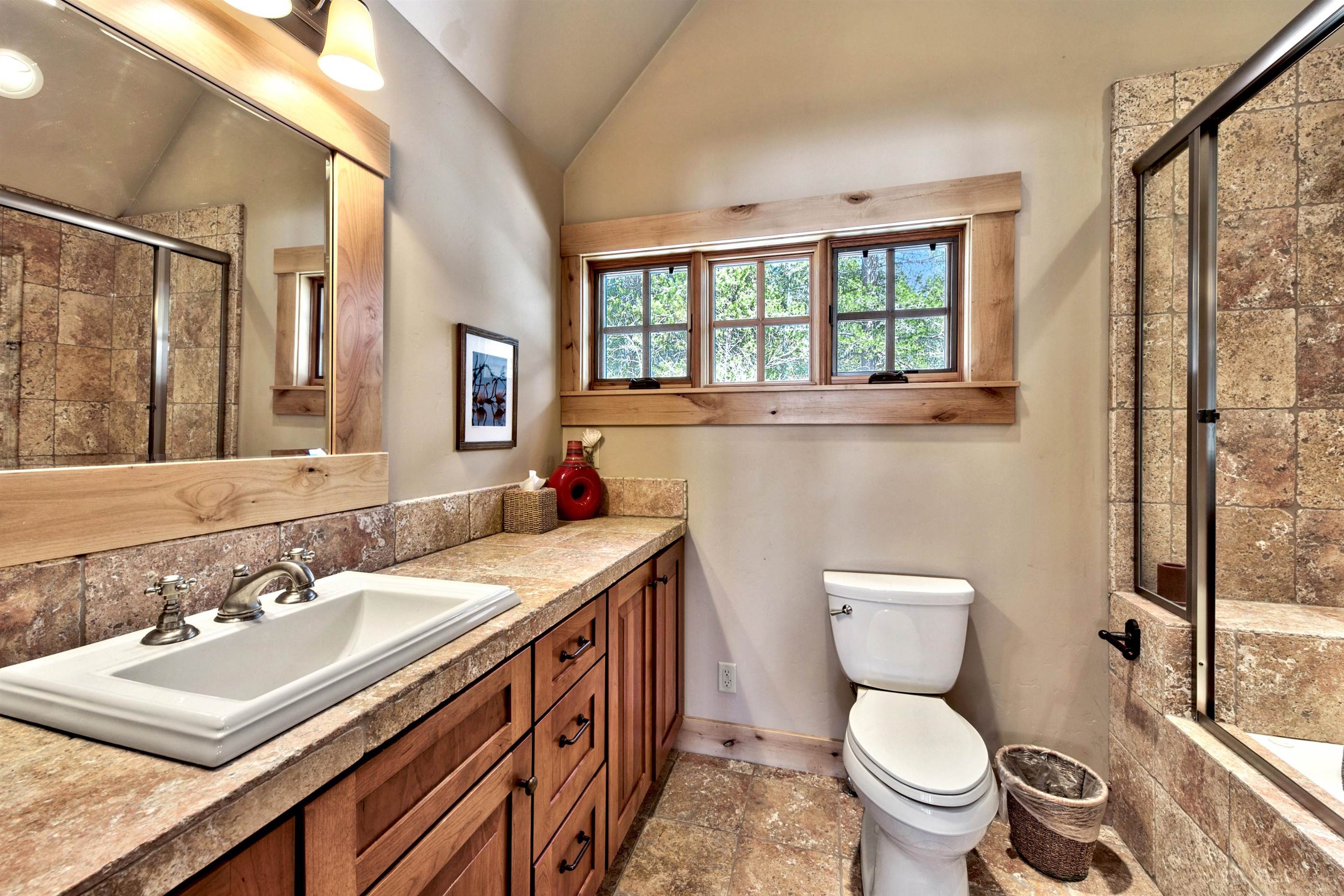 11368 Bennett Flat Road Truckee, CA 96161 - Photo 20 of 21 a bathroom with a sink toilet and a mirror