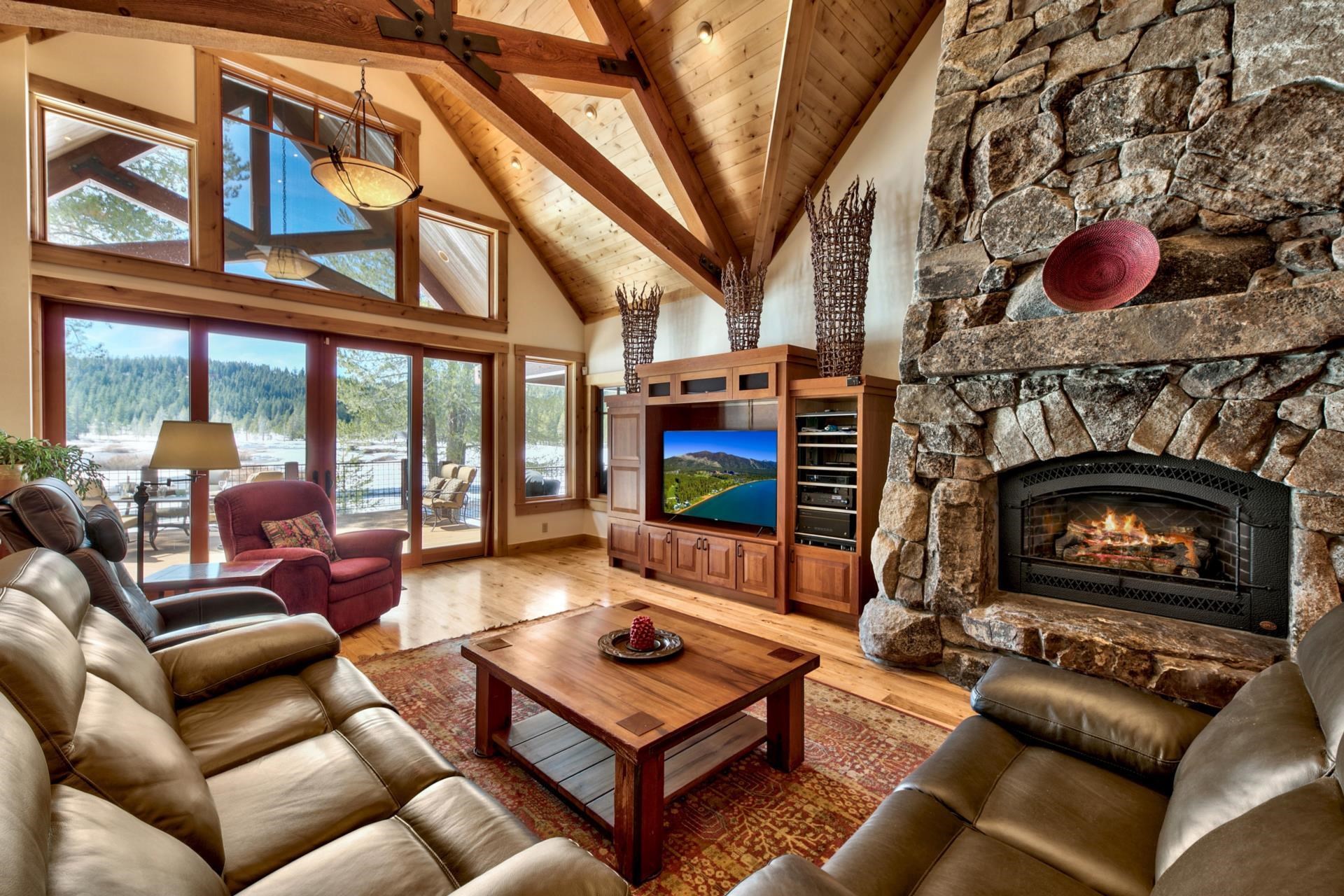 11368 Bennett Flat Road Truckee, CA 96161 - Photo 4 of 21 a living room with furniture a flat screen tv and a fireplace