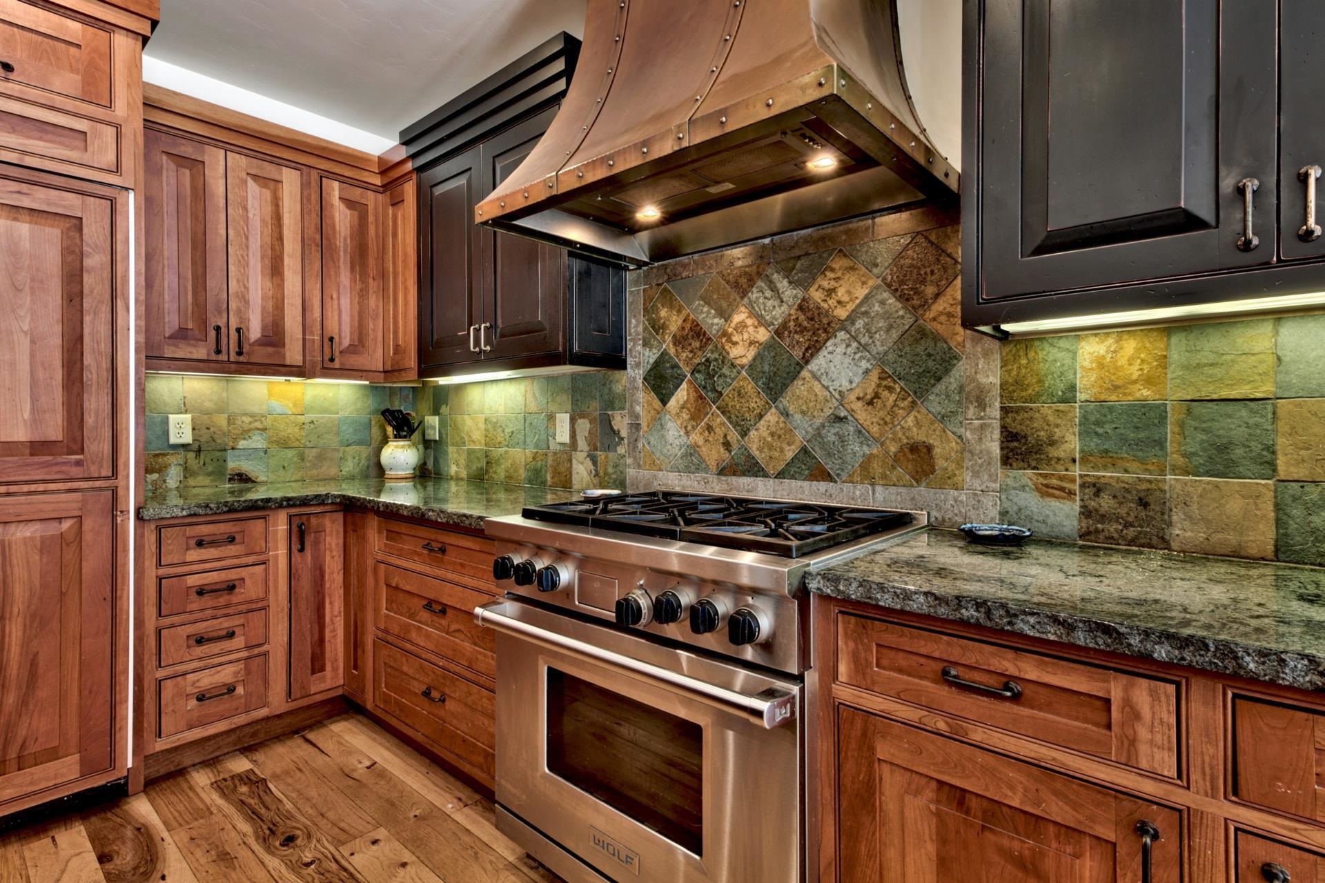 11368 Bennett Flat Road Truckee, CA 96161 - Photo 5 of 21 a kitchen with granite countertop a stove and a sink