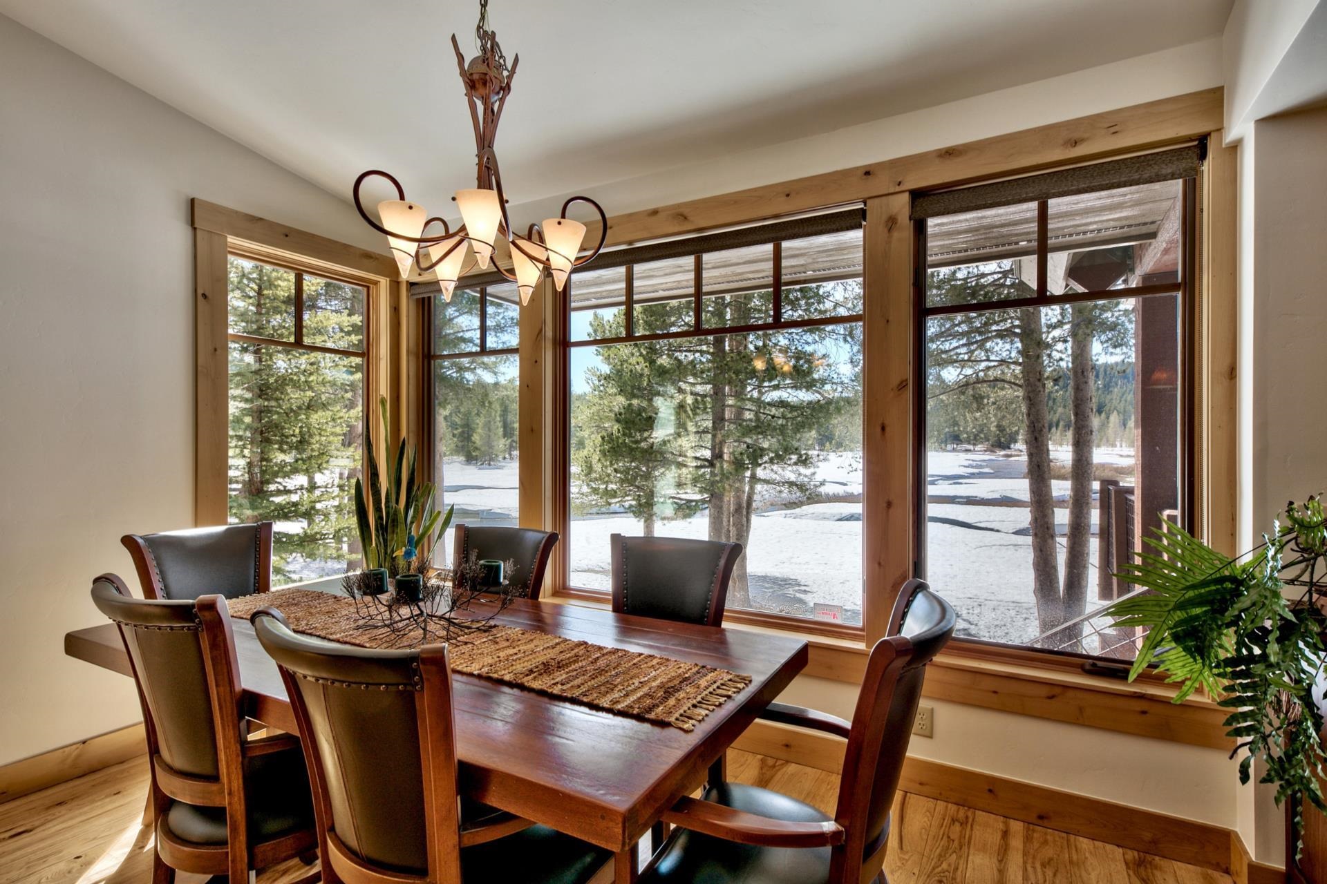11368 Bennett Flat Road Truckee, CA 96161 - Photo 9 of 21 a view of a dining room with furniture large windows and wooden floor