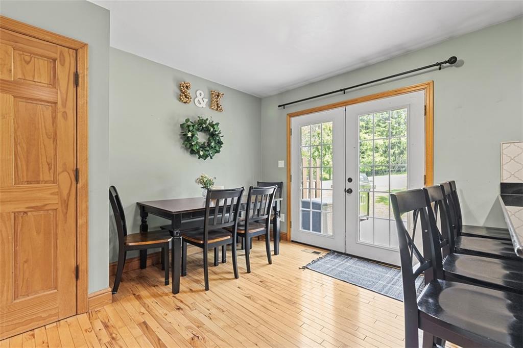 381 Golden Grove Road Baden, PA 15005 - Photo 15 of 38 a view of a dining room with furniture window and wooden floor
