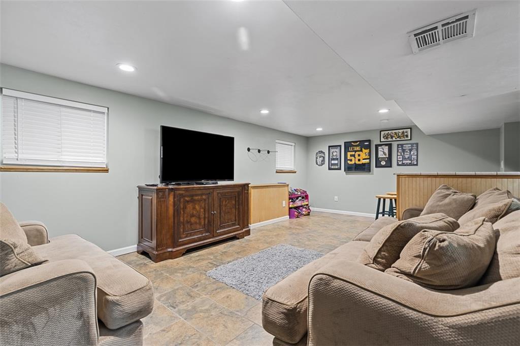 381 Golden Grove Road Baden, PA 15005 - Photo 24 of 38 a living room with furniture and a flat screen tv