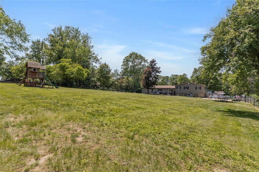 381 Golden Grove Road Baden, PA 15005 - Photo 32 of 38 a view of a field of grass and trees