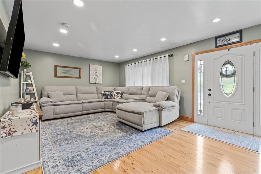 381 Golden Grove Road Baden, PA 15005 - Photo 6 of 38 a living room with furniture and a flat screen tv