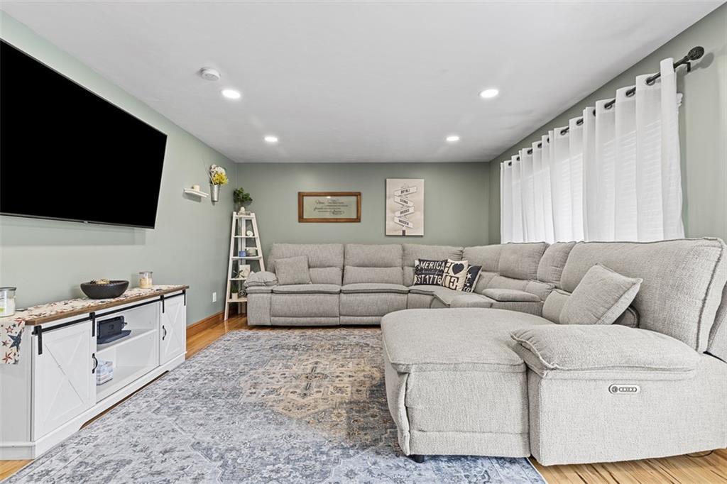 381 Golden Grove Road Baden, PA 15005 - Photo 7 of 38 a living room with furniture and a flat screen tv