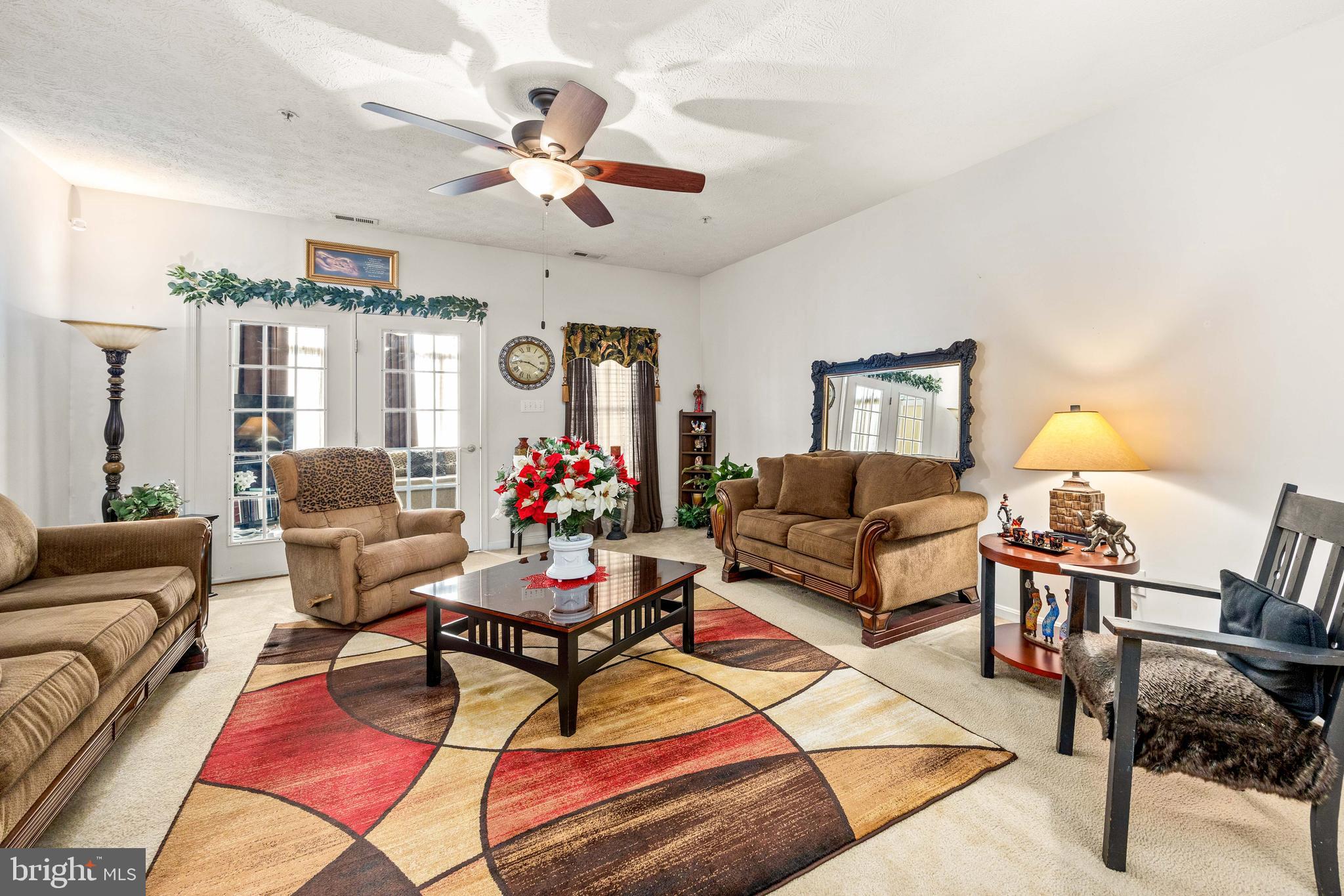 9529 Wedge Way Delmar, MD 21875 - Photo 11 of 39 a living room with furniture and a chandelier