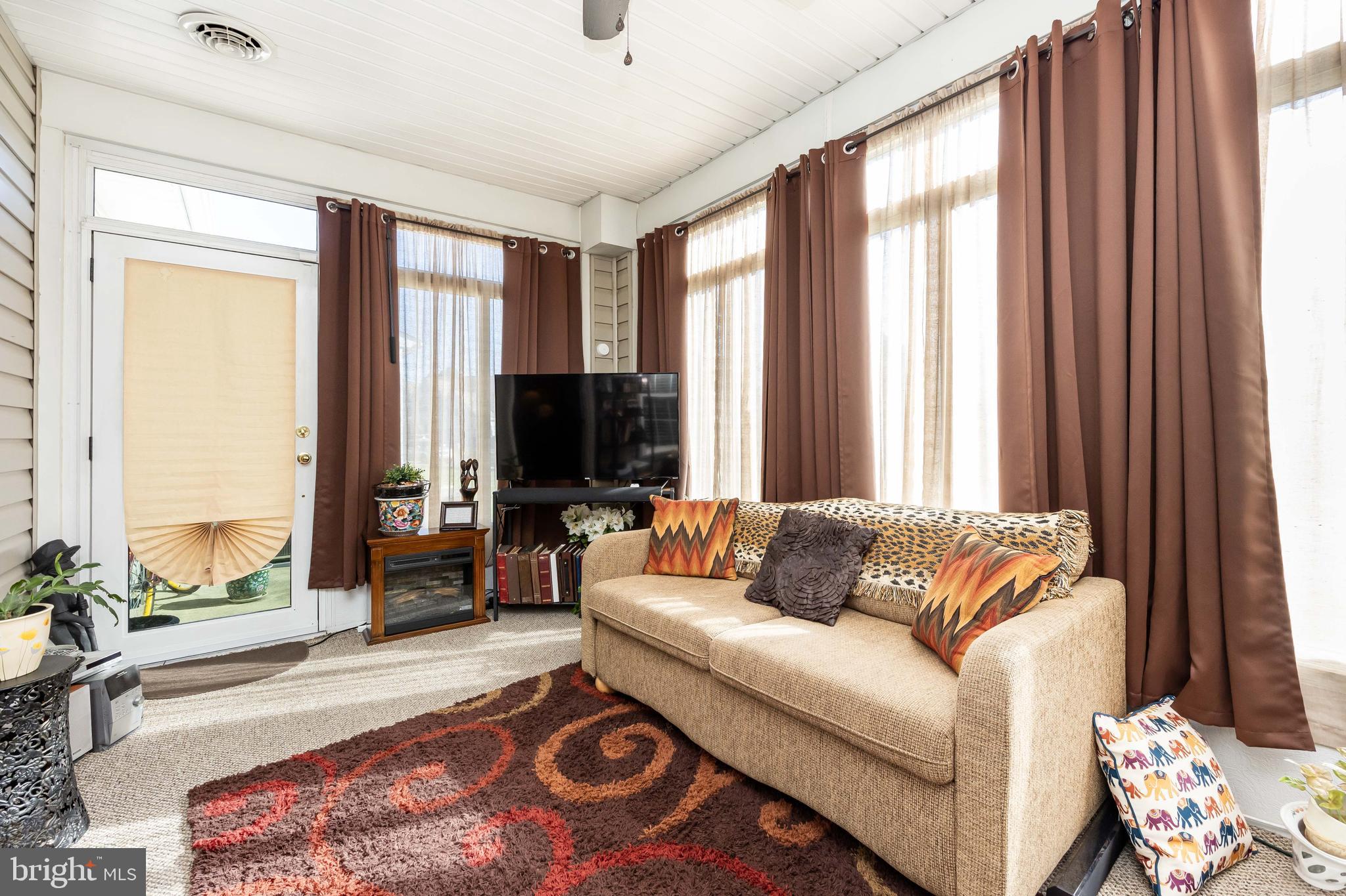 9529 Wedge Way Delmar, MD 21875 - Photo 23 of 39 a living room with furniture and large windows