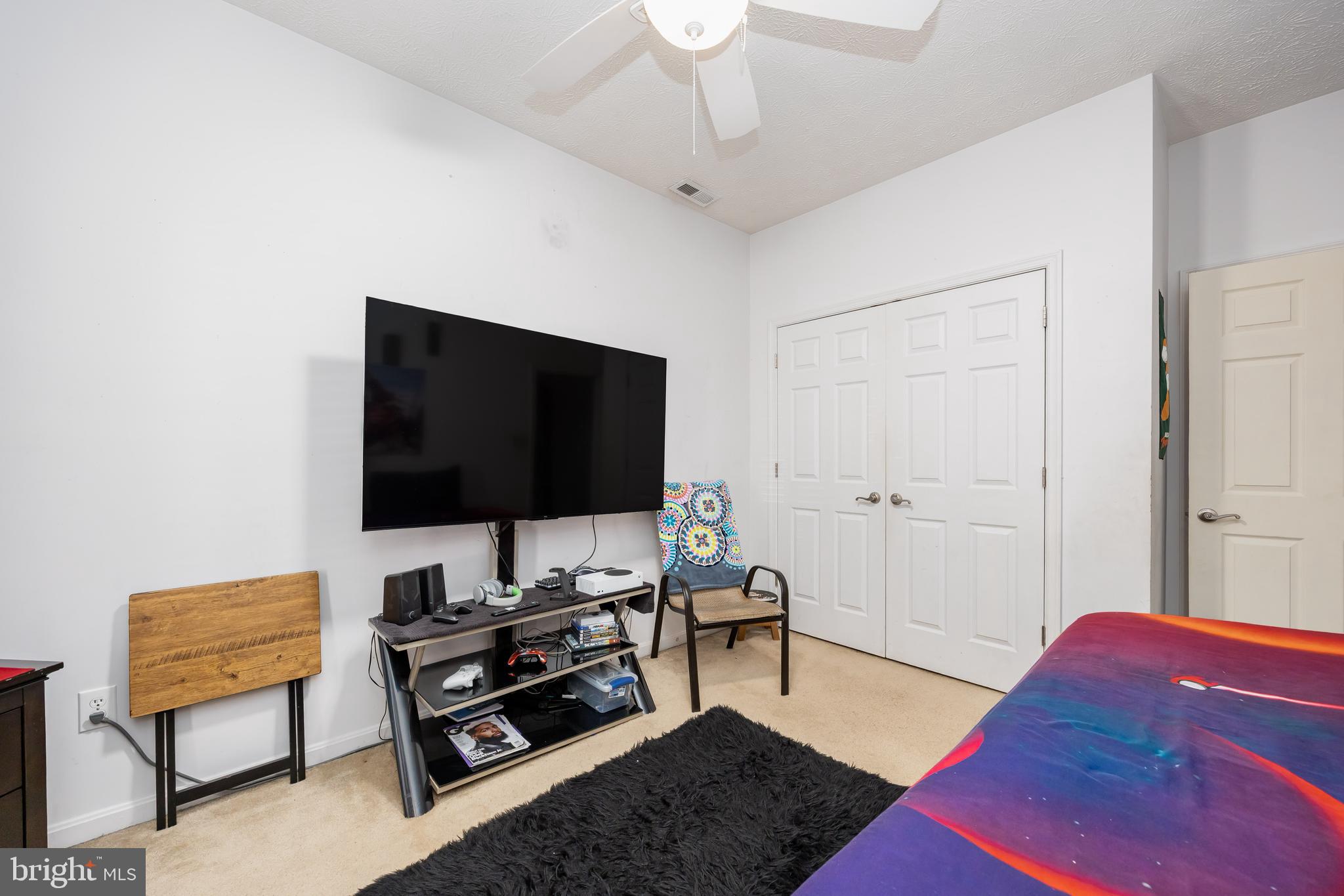 9529 Wedge Way Delmar, MD 21875 - Photo 25 of 39 a living room with furniture and a flat screen tv