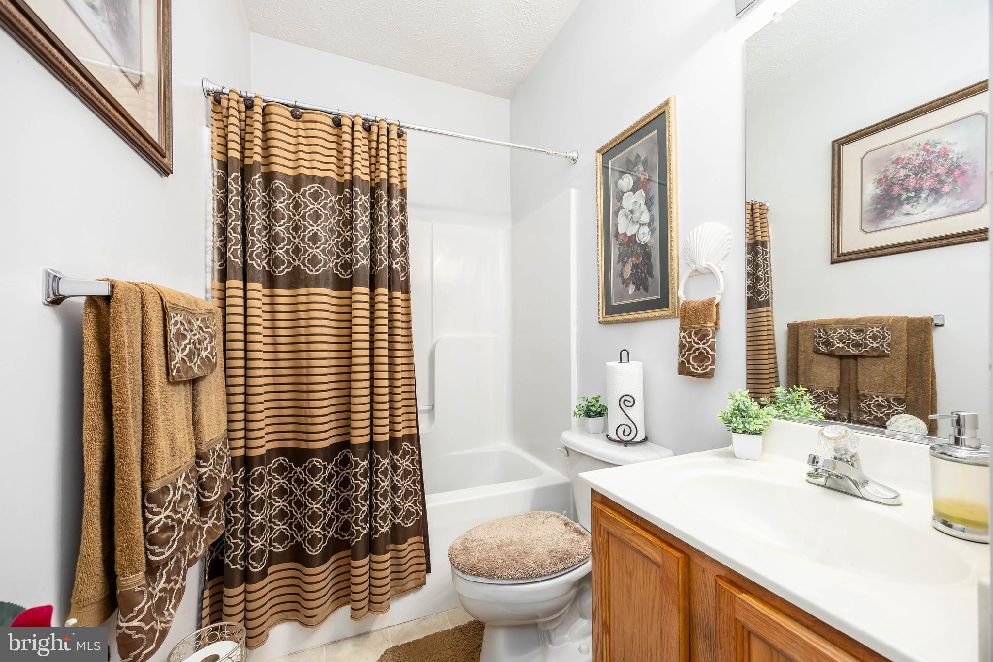 9529 Wedge Way Delmar, MD 21875 - Photo 26 of 39 a bathroom with a sink toilet and shower