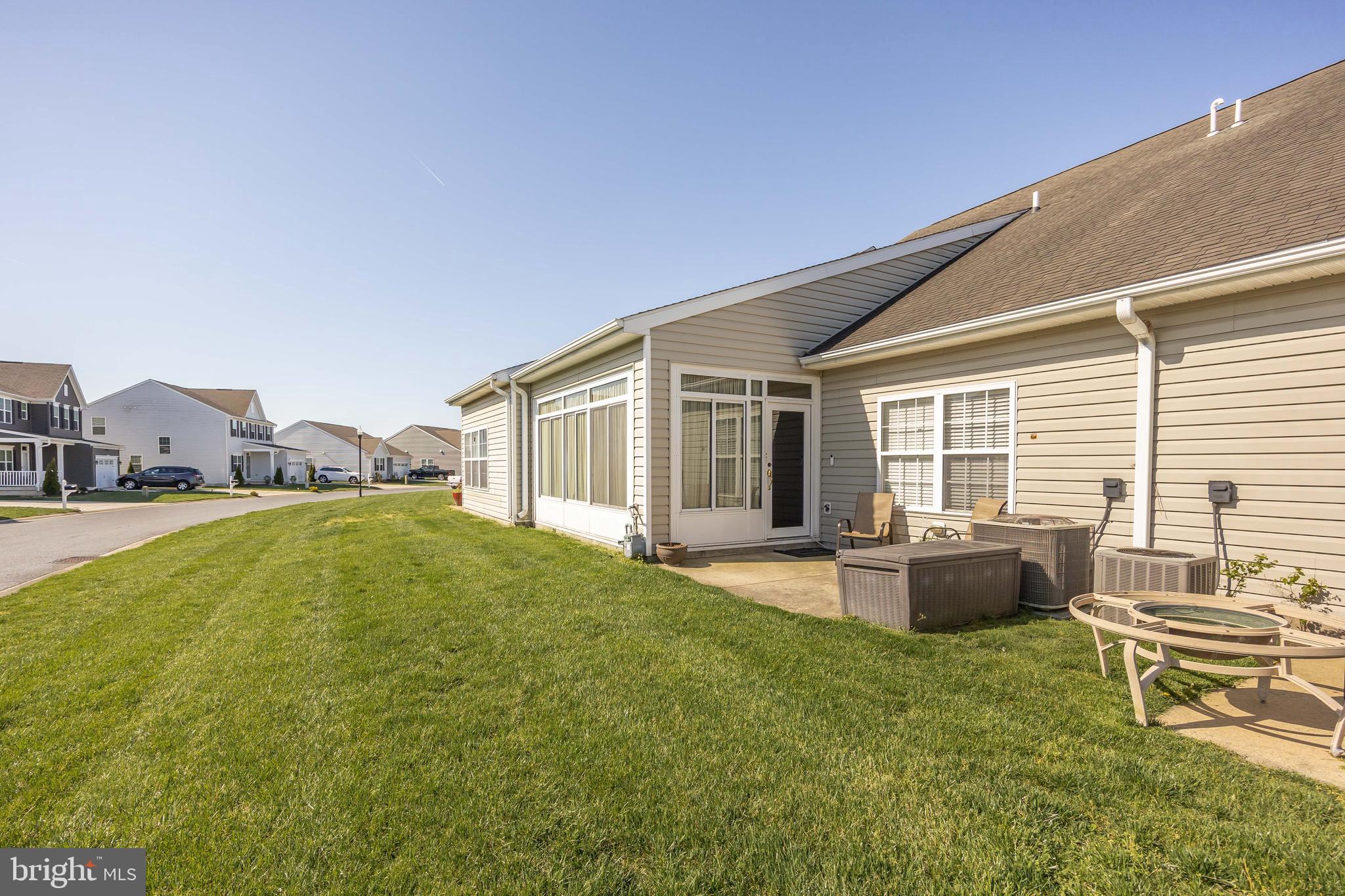 9529 Wedge Way Delmar, MD 21875 - Photo 31 of 39 a swimming pool with outdoor seating and yard