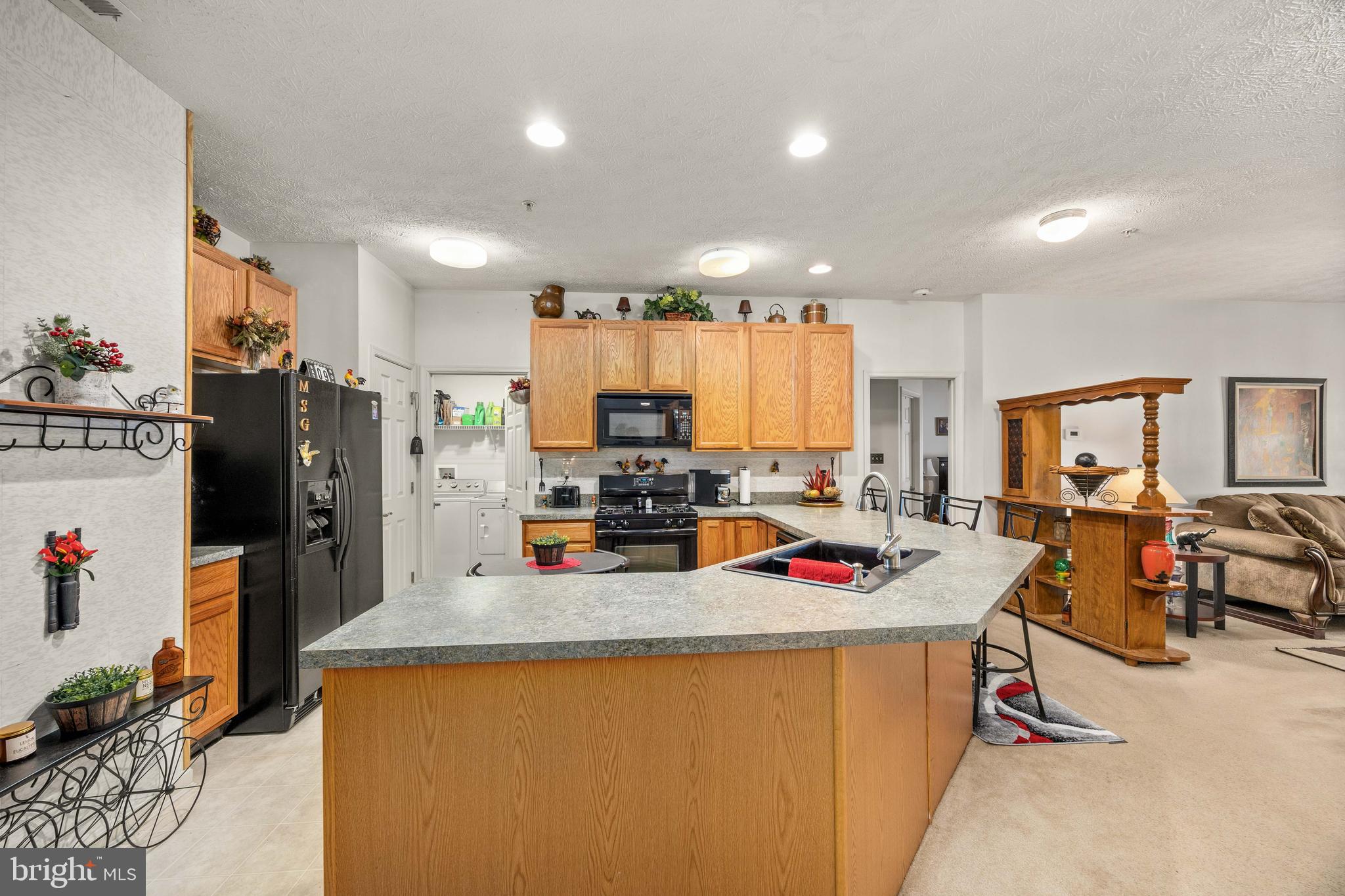 9529 Wedge Way Delmar, MD 21875 - Photo 9 of 39 a kitchen with stainless steel appliances granite countertop a refrigerator a sink dishwasher and a stove