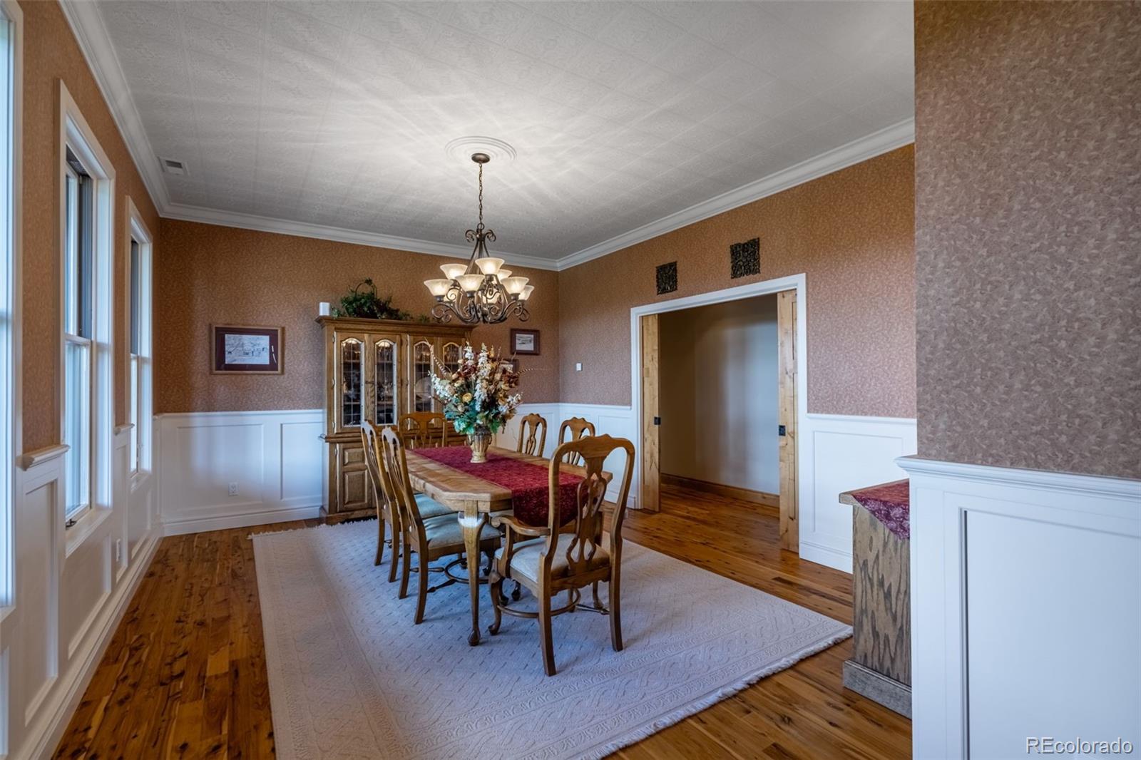157 Cap Rock Road Canon City, CO 81212 - Photo 12 of 50 a view of a dining room with furniture and chandelier