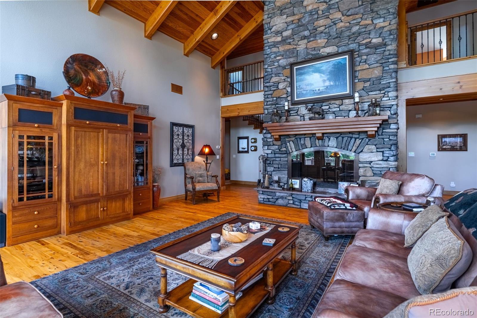 157 Cap Rock Road Canon City, CO 81212 - Photo 17 of 50 a living room with furniture pool table and a fireplace