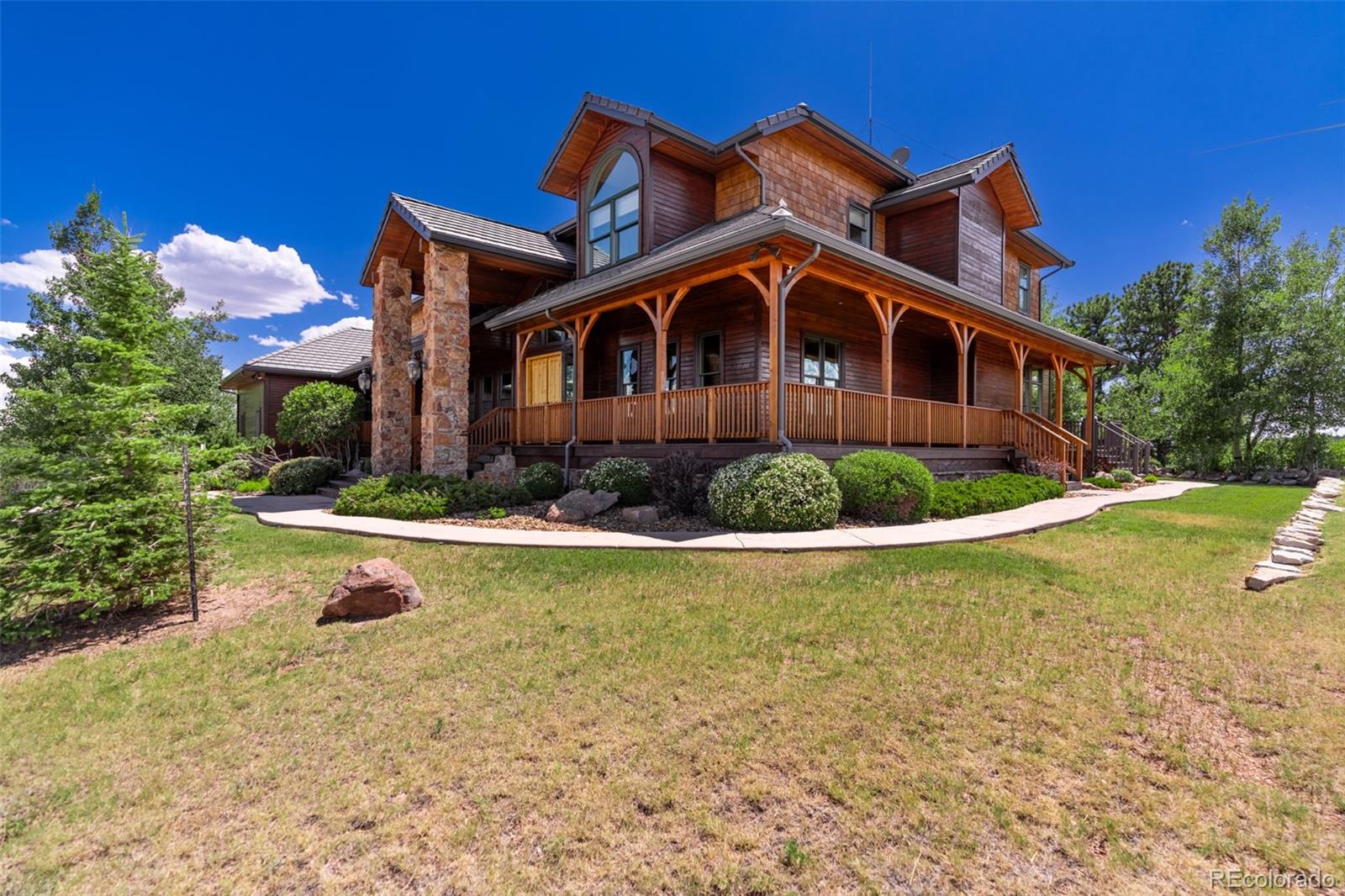 157 Cap Rock Road Canon City, CO 81212 - Photo 2 of 50 a front view of a house with swimming pool
