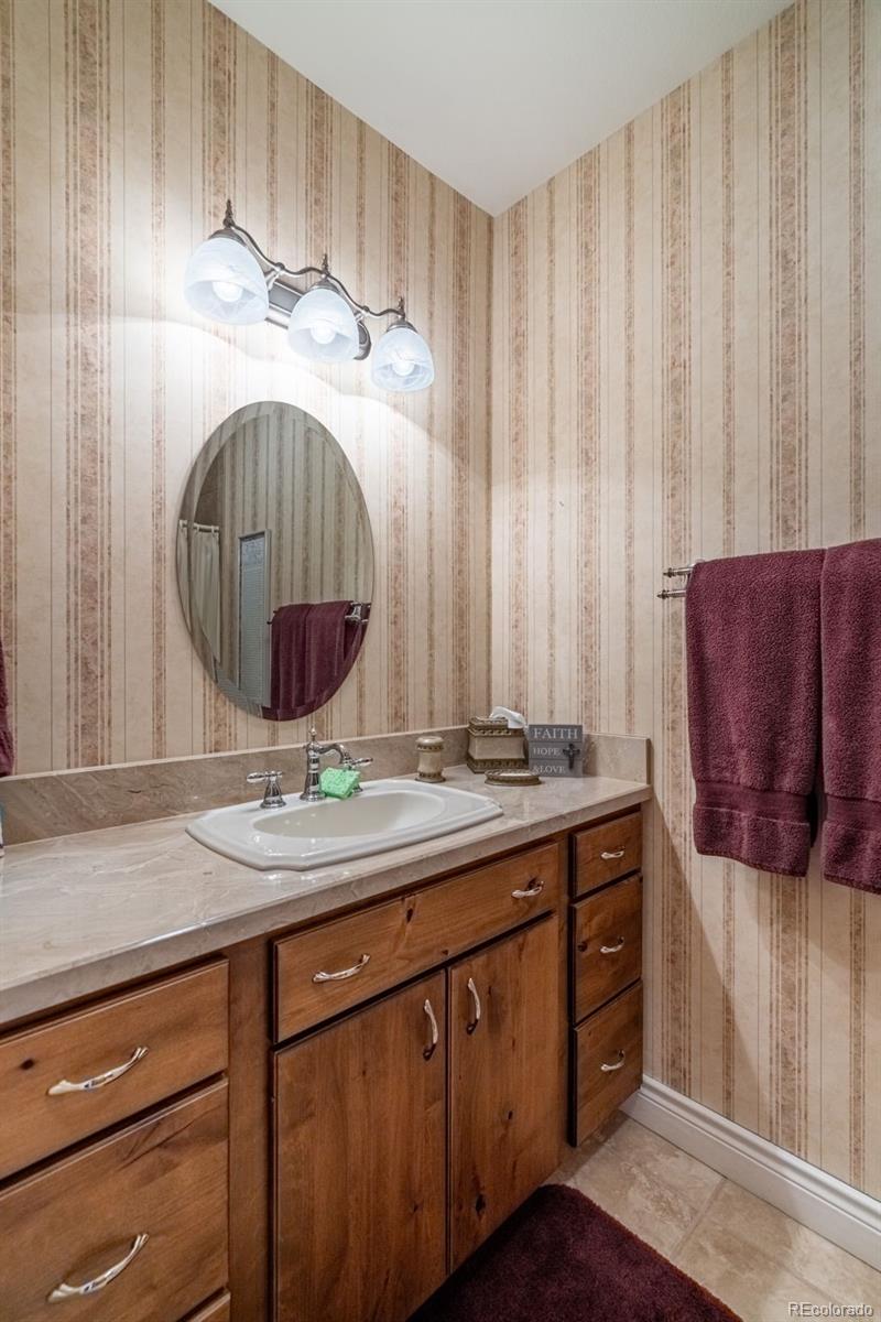 157 Cap Rock Road Canon City, CO 81212 - Photo 28 of 50 a bathroom with a sink and a mirror