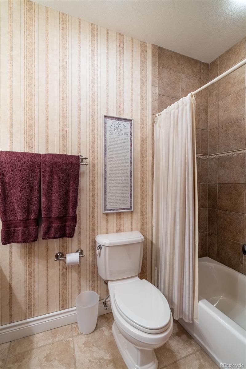 157 Cap Rock Road Canon City, CO 81212 - Photo 29 of 50 a bathroom with a toilet and a shower