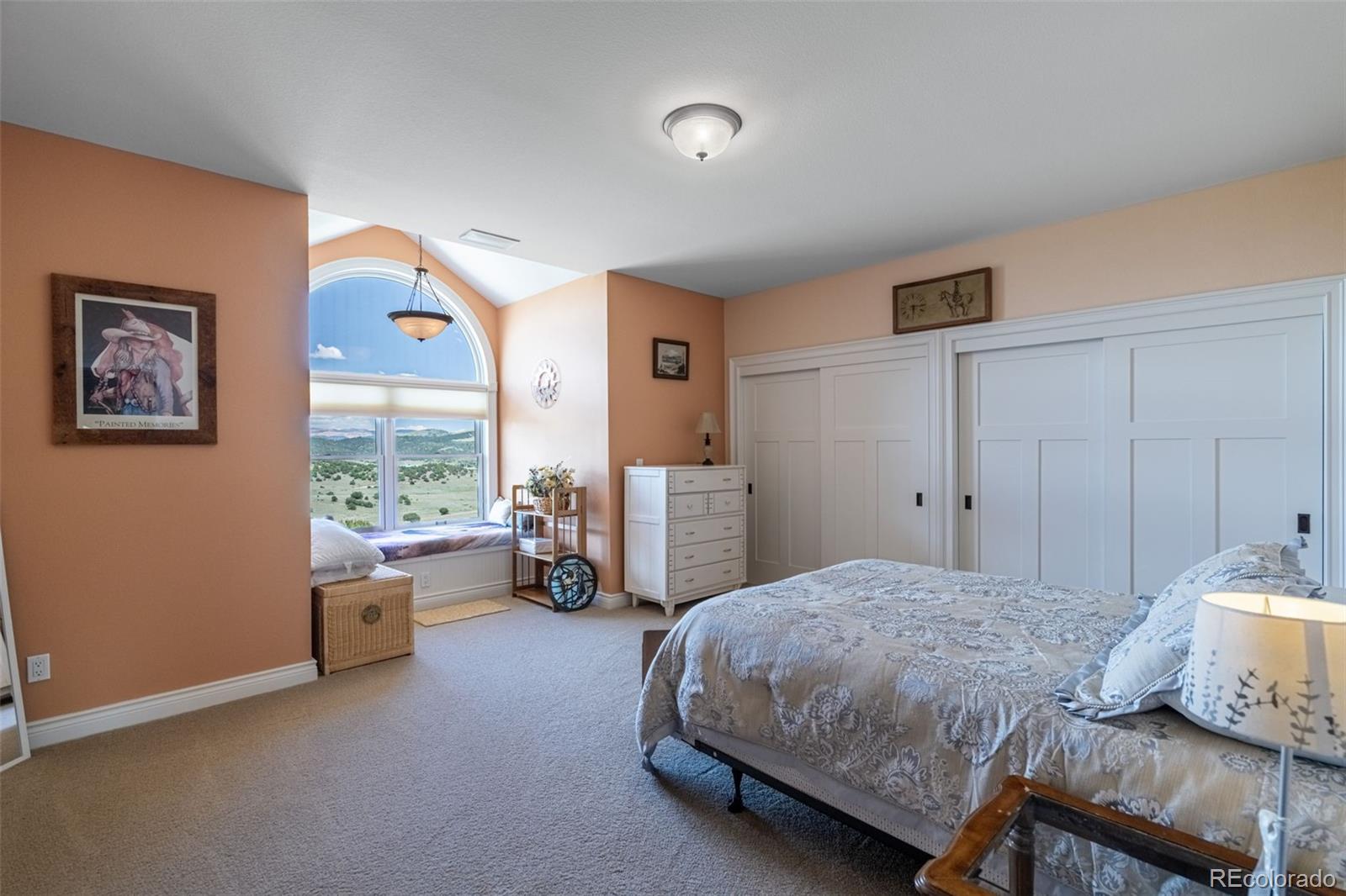 157 Cap Rock Road Canon City, CO 81212 - Photo 30 of 50 a bedroom with a bed and a couch
