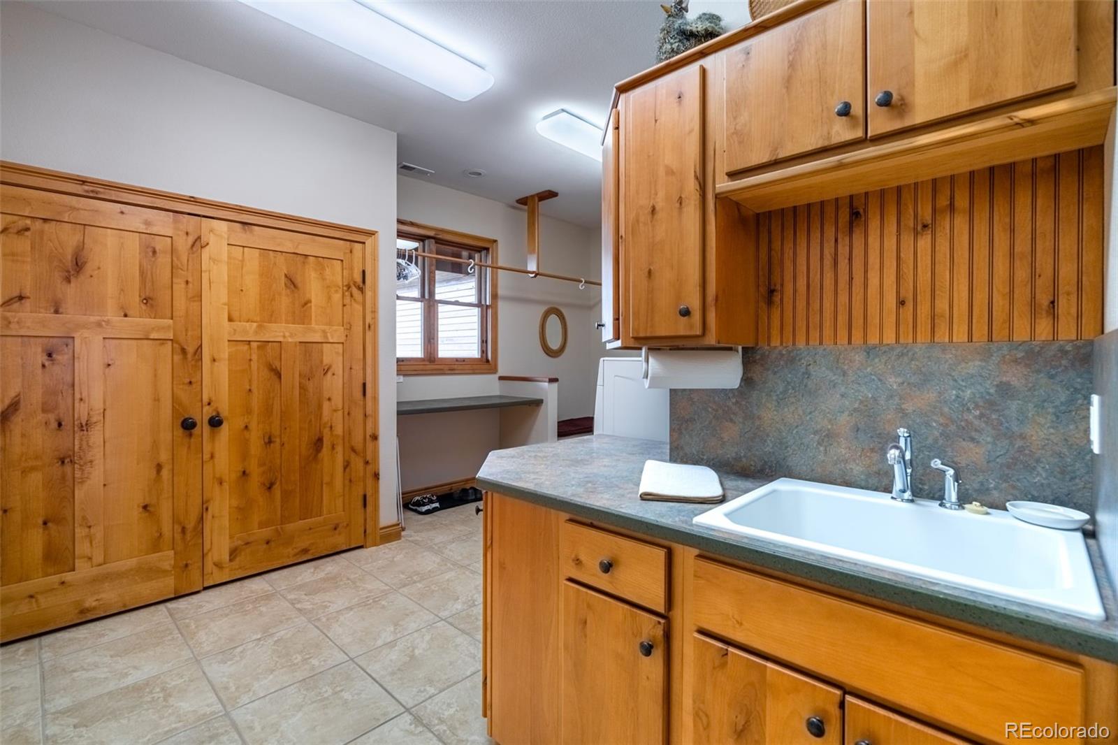 157 Cap Rock Road Canon City, CO 81212 - Photo 37 of 50 a kitchen with a sink and cabinets