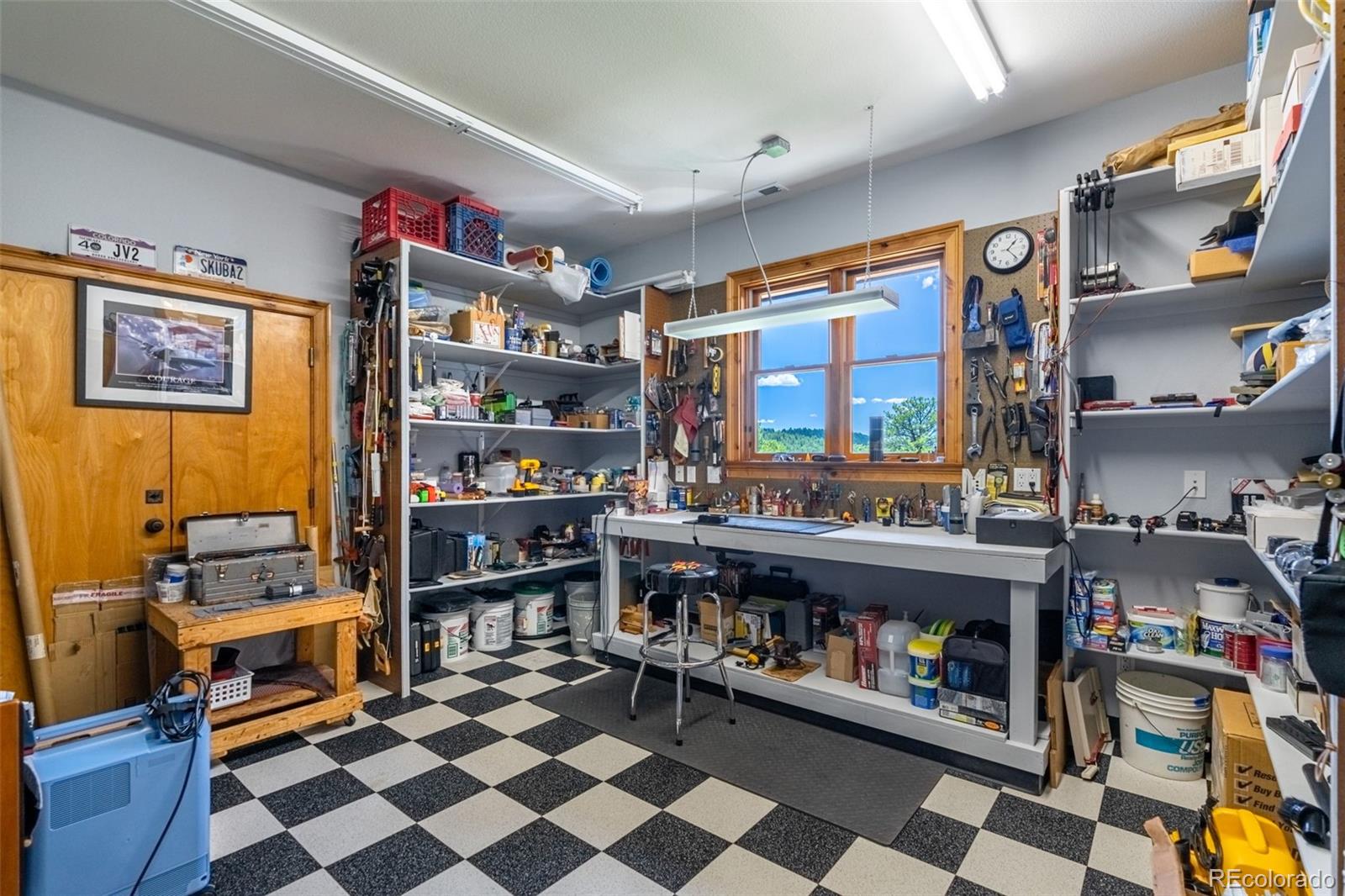157 Cap Rock Road Canon City, CO 81212 - Photo 43 of 50 a room with lots of books and a large window